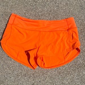 Size 6 orange lululemon speed up shorts 2.5 inches